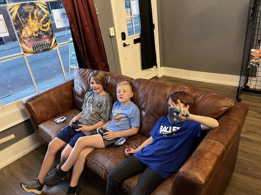 Kids relaxing on the couch in the lounge